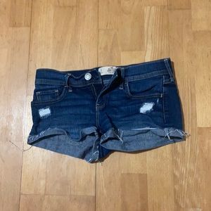 Size 3, Waist 26 Hollister Short-Short Low Rise Shorts. Dark Blue Wash.